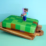 Minecraft®-Figur auf Spielewelt-Torte