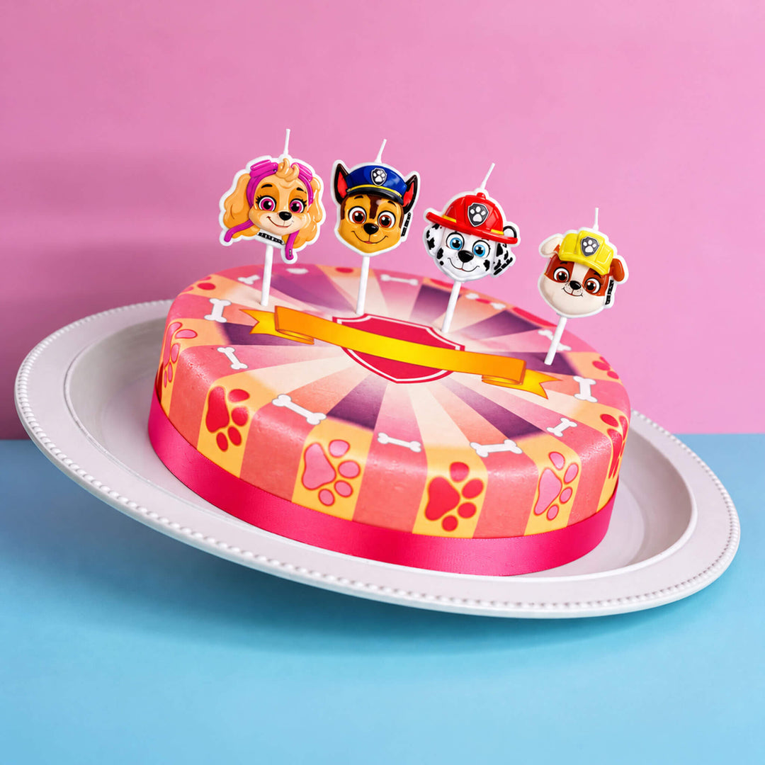 Paw Patrol® auf pinker Hundepfoten-Torte
